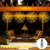 Outdoor lighting featuring multiple firework lights hanging from a wooden pergola over seating area.