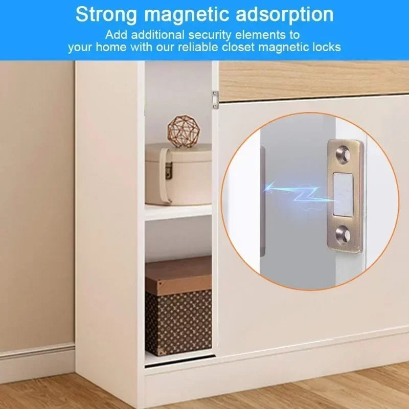 A close-up of a white cabinet door with a magnetic latch mechanism, showing a security feature.