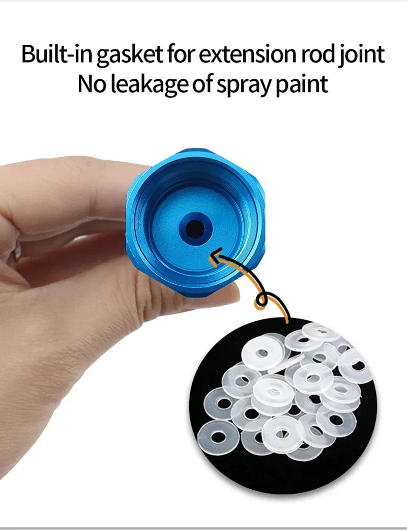 A hand holds a blue paint sprayer component with an extension rod joint and a black disk containing multiple white O-rings.