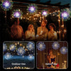 A family enjoying a festive evening with LED fairy light string lights decorating the outdoor and indoor setting.