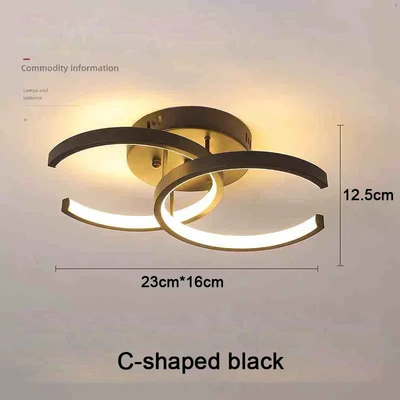 Lámpara de techo moderna negra en forma de C con difusor circular LED.