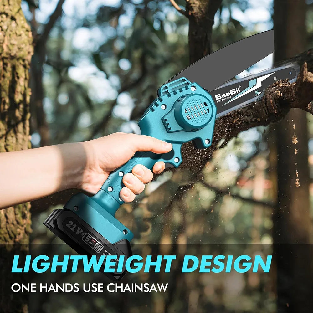 A hand holds a blue and black cordless mini chainsaw, demonstrating its lightweight design while cutting wood.