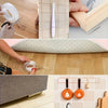 Hands apply clear double-sided mounting tape to a wooden surface and a glass panel.