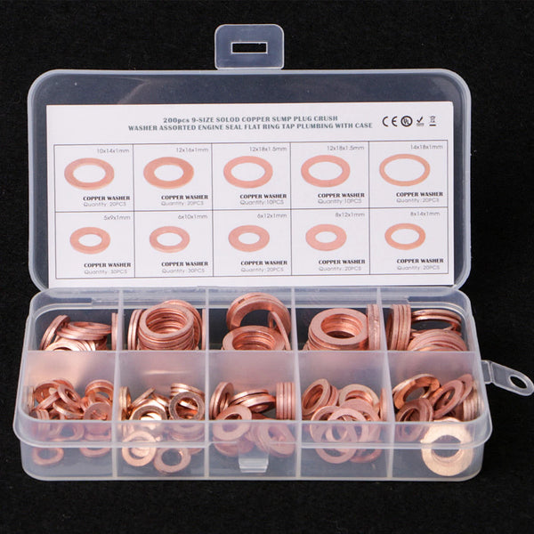 A clear plastic box containing assorted copper washer and plug parts for engine use.