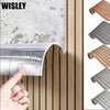 Close-up of a self-adhesive wood grain wall panel showing the texture and edge profile.