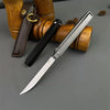 A silver folding knife with a black handle is shown next to a leather sheath and wooden components.