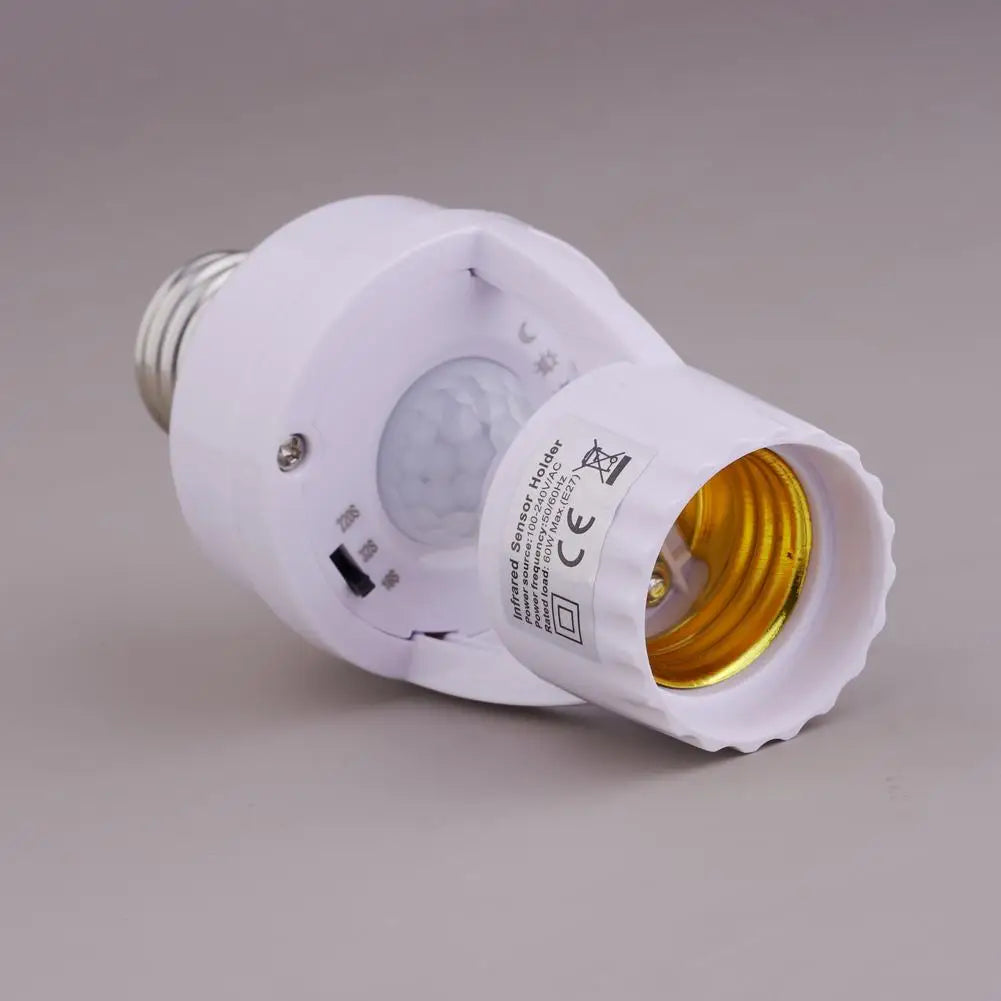 A white infrared sensor holder adapter for a light bulb, shown in a product photograph.