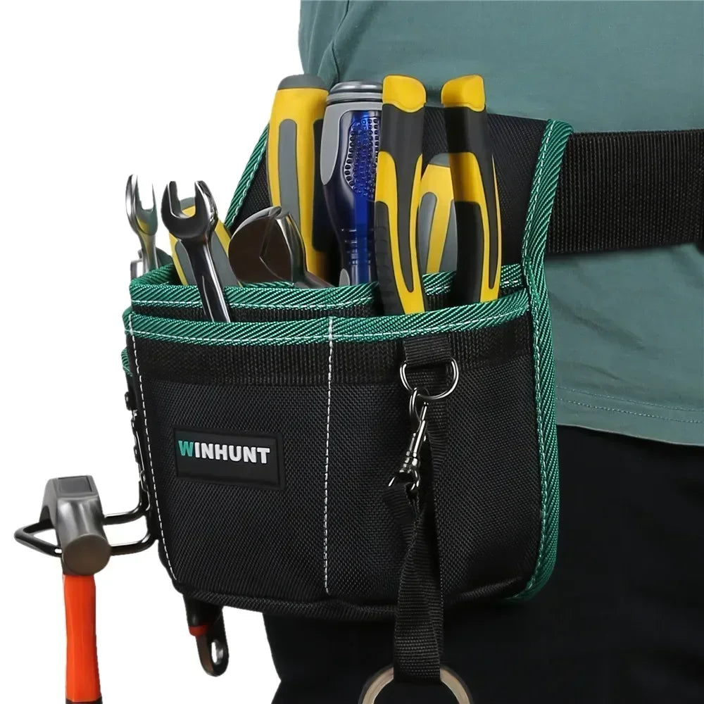 A black tool belt pouch filled with yellow and silver tools carried on a green strap.