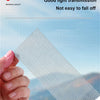 A hand holds a piece of mesh window screen material demonstrating good light transmission and durability.