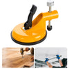 A yellow heavy duty wall tile leveler with a suction cup is shown being used to level tiles on a wooden surface.
