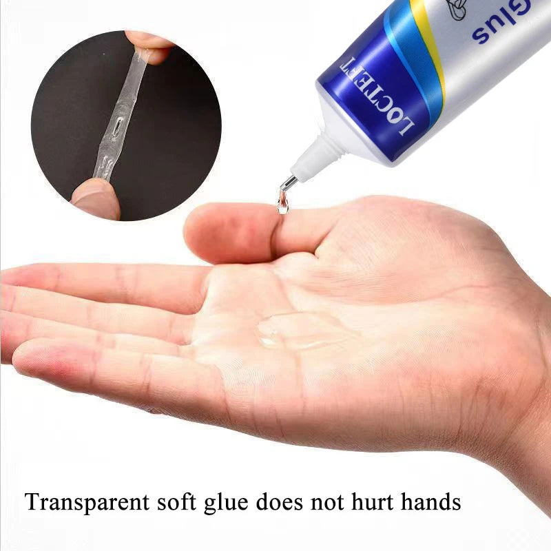 Une main applique de la colle transparente d'un tube sur une surface, montrant que la colle souple transparente ne fait pas m