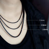 Close-up of black waxed cord rope necklaces with varying diameters, showing different sizes for DIY jewelry making.