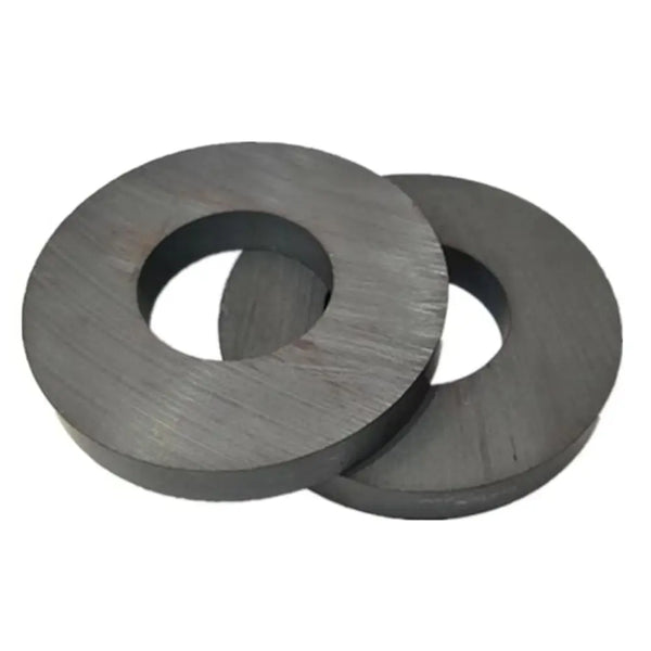 A set of two industrial ceramic ring magnets, dark gray in color.