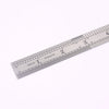 A stainless steel measuring ruler showing markings in inches and centimeters.
