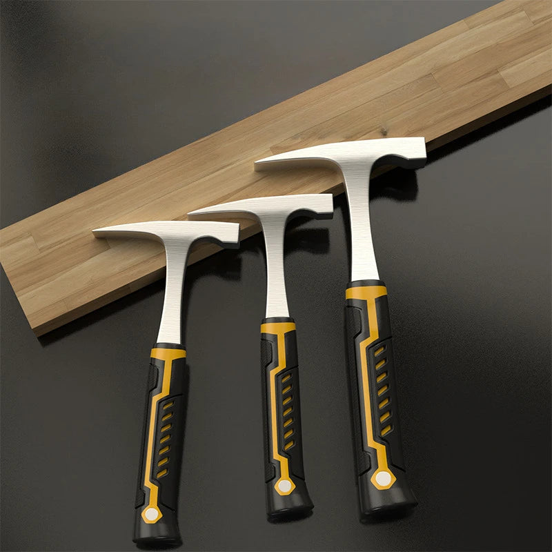 Three silver rock pick hammers resting on a wooden surface.
