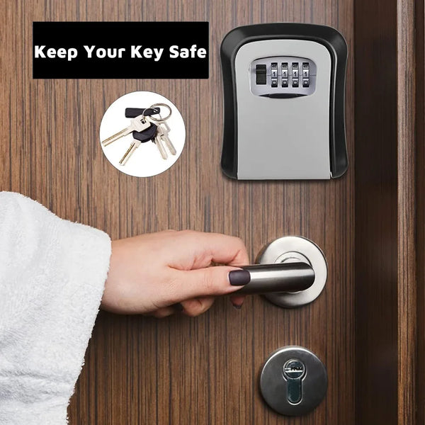 A hand is operating a wall-mounted security key lock box on a wooden door, with a key visible nearby.