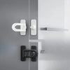 Close-up of modern gray and white refrigerator door locks and hardware.