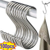 A set of silver stainless steel hanging hooks with a curved design shown against a metal rod and a towel.