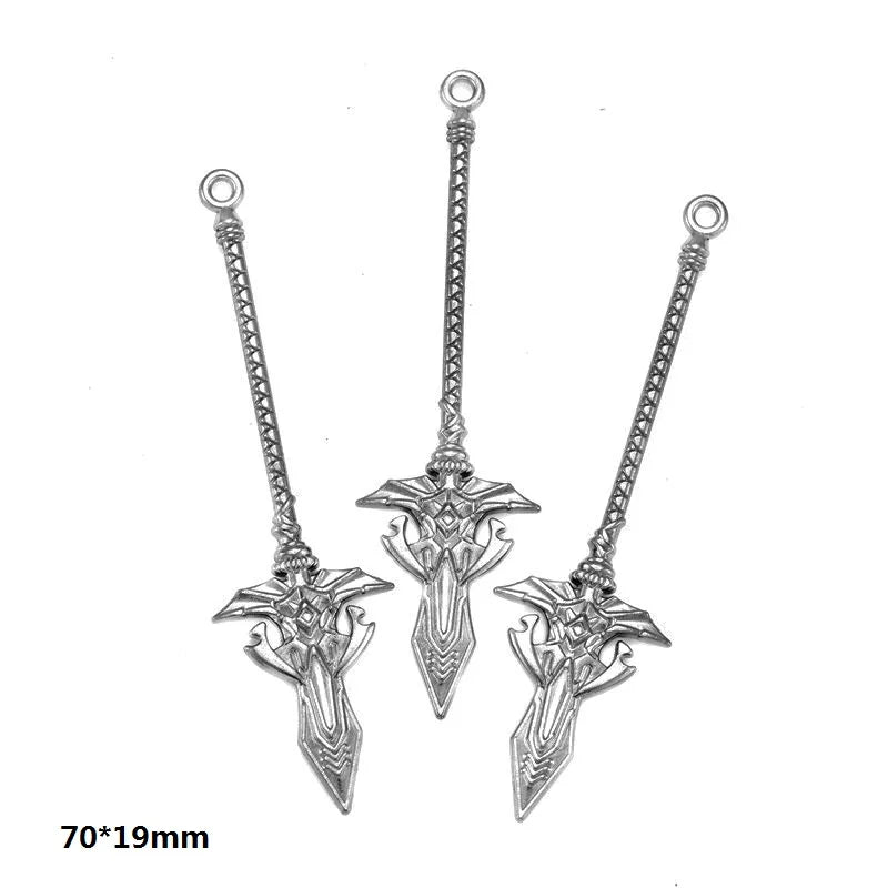 A pair of silver-toned alloy charms featuring intricate, multi-style designs for DIY jewelry making.