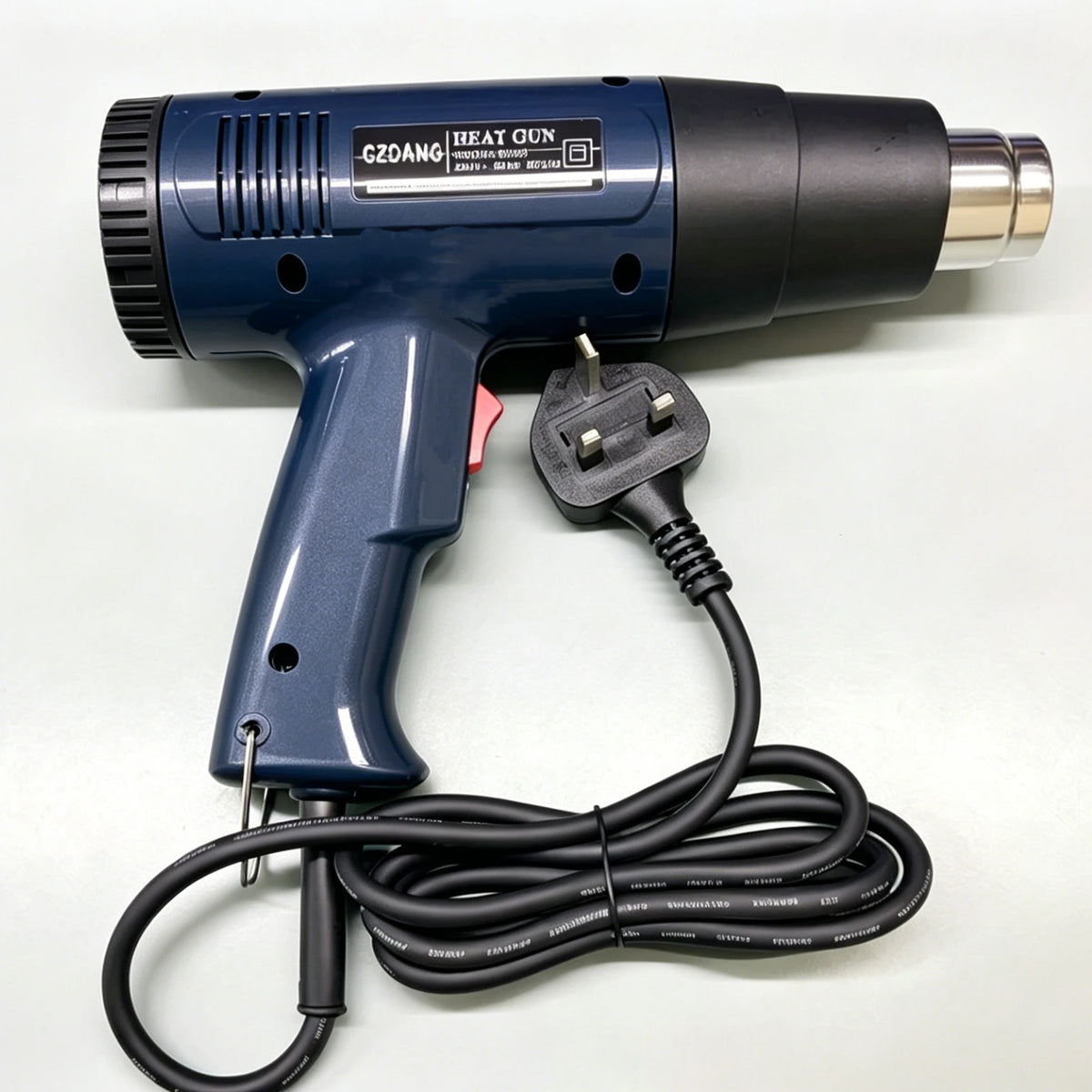 Dunkelblaue digitale Heißpistole mit schwarzem Griff und Kabel auf weißer Oberfläche.