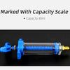 A blue precision oil and dye injector kit with a capacity scale, shown horizontally.
