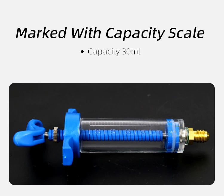 A blue precision oil and dye injector kit with a capacity scale, shown horizontally.