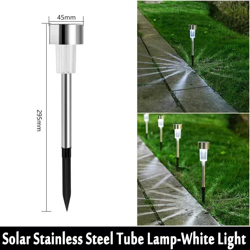 A solar stainless steel tube lamp with a white light mounted on a black base, shown in an outdoor pathway context.