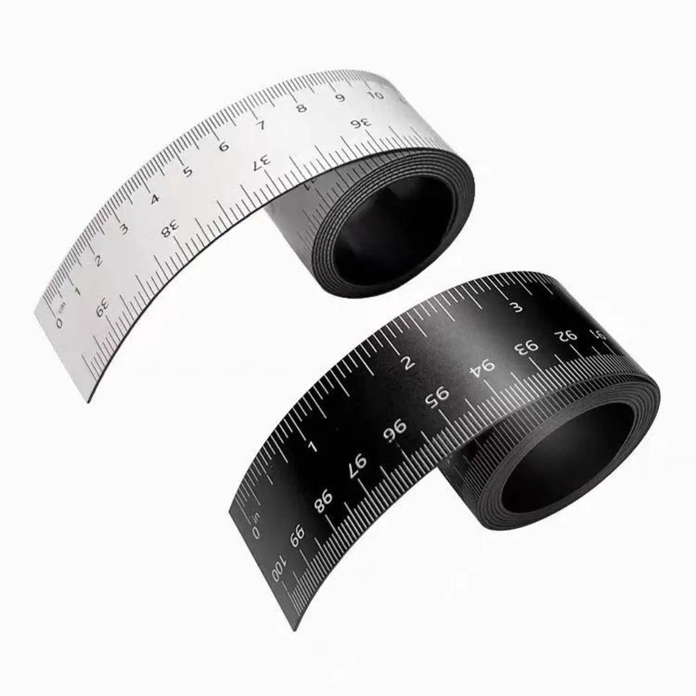 A black magnetic dual scale flexible measuring ruler shown in a rolled-up form.