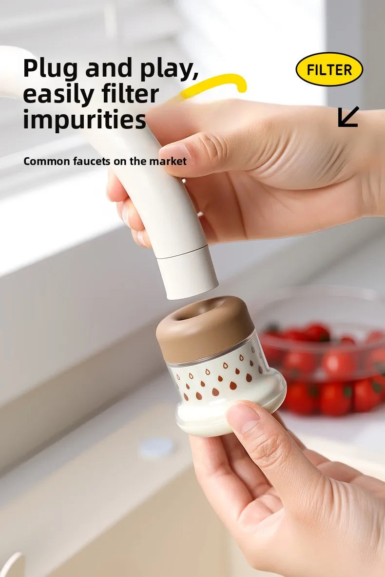 A hand is using an extendable tap filter sprayer to clean a faucet, demonstrating how to easily filter impurities.