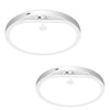 A white wireless motion sensor ceiling light fixture with a circular diffuser and a control panel on top.