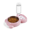 Set de dispensador automático para alimentar mascotas de color rosa con botella de agua transparente y un tazón de comida sec