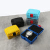 A collection of black and blue impact-resistant watch storage cases, including a yellow case and an open silver wristwatch.