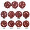 A set of abrasive sanding discs in various grits, ranging from 60 to 1500, for orbital sanders.
