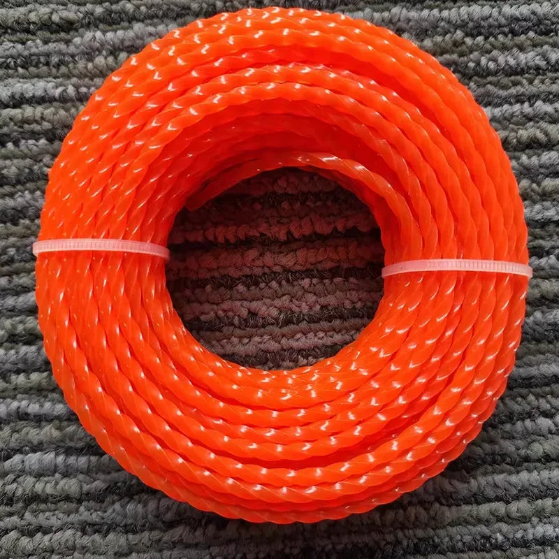 A coil of bright orange heavy duty lawn trimming line spools resting on a gray textured mat.