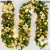 Green LED rattan garland with white flowers used for Christmas decor