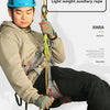 A man wearing a helmet and clothing is holding a light weight auxiliary rope for outdoor descent protection.