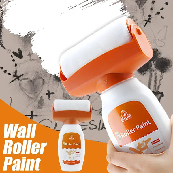 A hand holds a white and orange roller paint kit with a brush, demonstrating wall roller paint application.