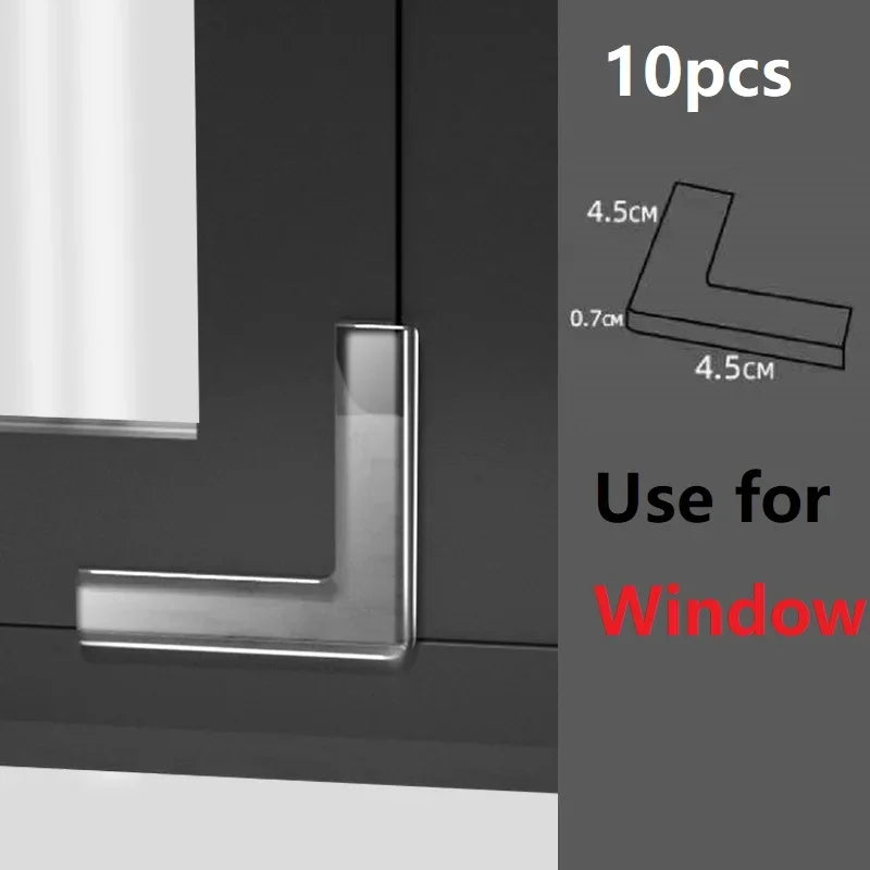 Silver silicone corner edge guards for window safety, shown in a close-up against a dark surface.