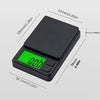 A black digital jewelry scale with a green display showing 0.00 grams.