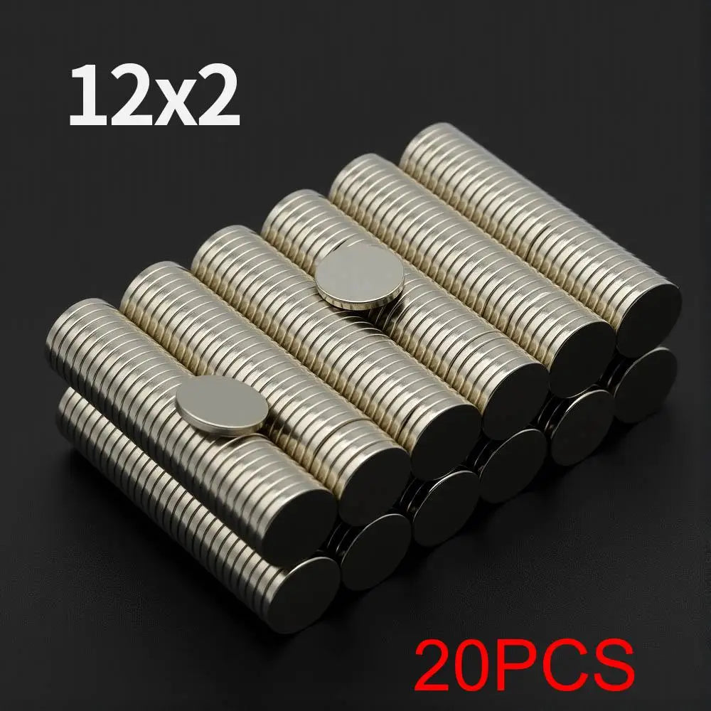 A pile of 20 fridge magnets, measuring 12x2, with silver and black finishes.