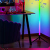 An RGB LED corner floor lamp illuminates a desk setup with musical notes floating in the air.