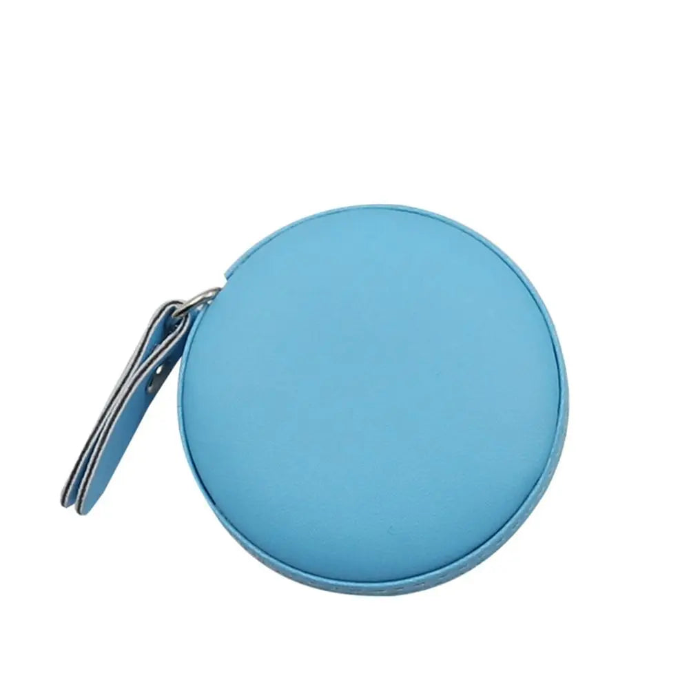 A light blue retractable dual scale measuring tape with a silver clasp.