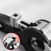 Close-up view of a black precision ratchet pipe cutter tool with a silver metal jaw and a hand showing the size markings.