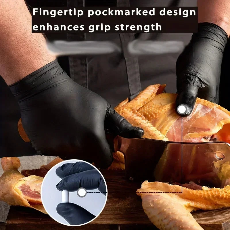 Hands wearing black nitrile gloves are using a finger-tip marked design to enhance grip strength on food.