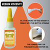 Bouteille de super glue avec une pointe jaune et un graphique triangulaire orange montrant comment insérer la micro-pointe da