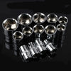 A set of twelve shiny metal wrenches and sockets arranged in a row on a dark surface.