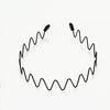 A black metal elastic headband with wavy design, shown against a white background.