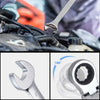 Close-up view of a silver precision reversible ratchet wrench set with various sizes and components.