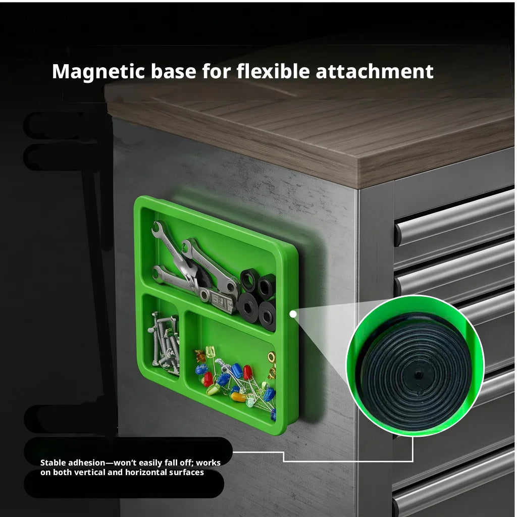 A green magnetic base with multiple compartments for flexible attachment on a cabinet surface.