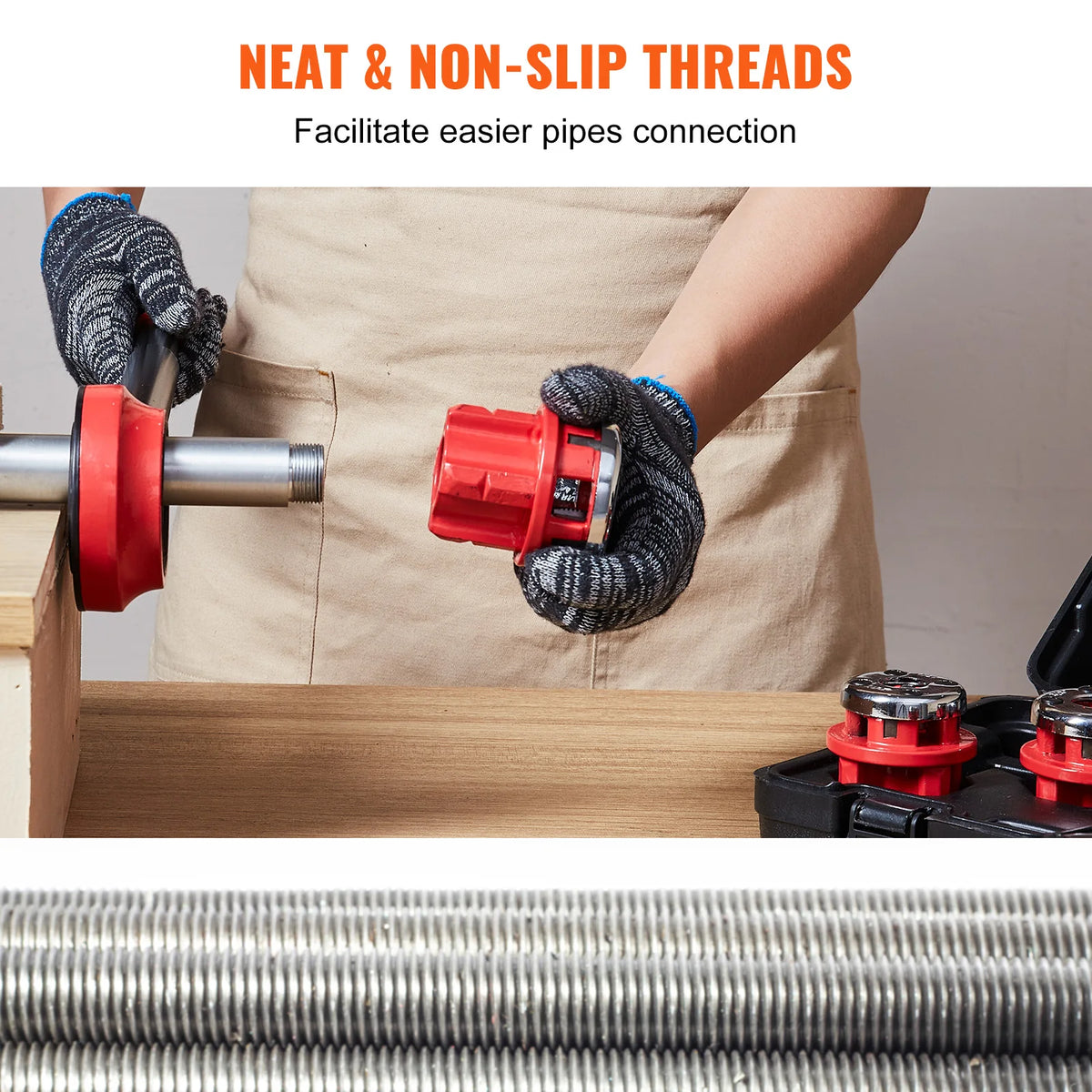 A person wearing gloves is using a red pipe threader tool to connect pipes, demonstrating neat and non-slip threads.